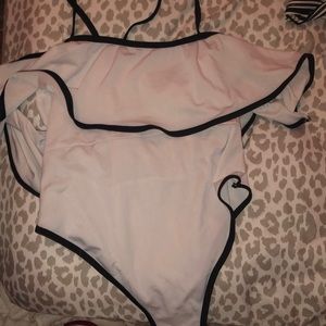 White and black ruffle one peice bikini.